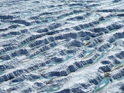 A close up of a snow covered slope.