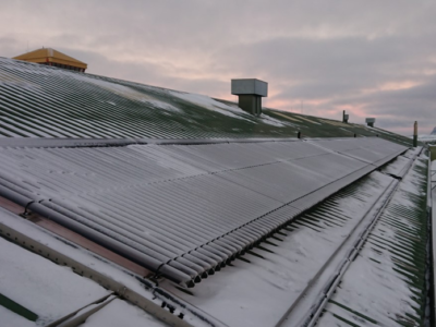 The roof of a building with solar panels