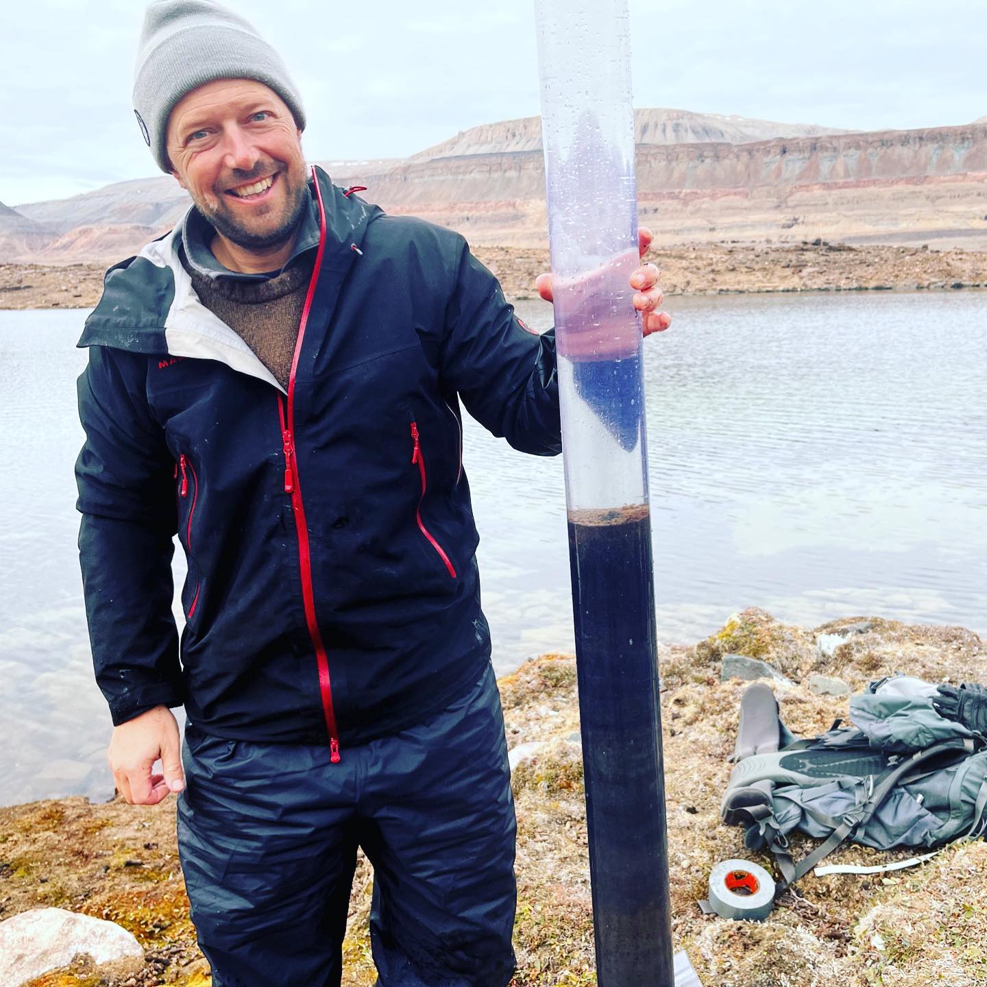 A man holding a tube