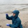 A person sitting at a beach