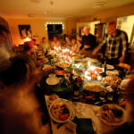 A group of people sitting at a table for dinner